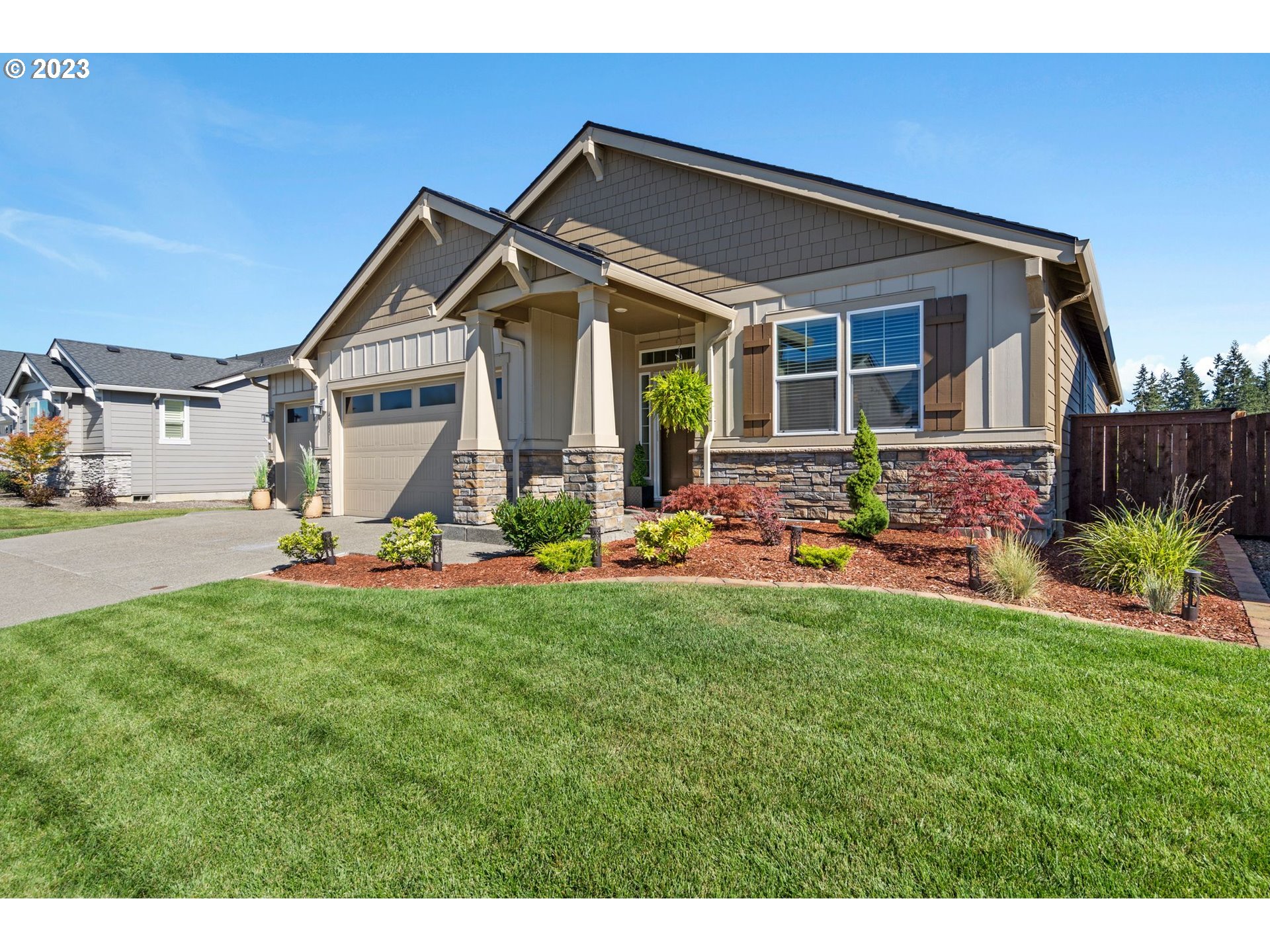 4805 South 17th Way Ridgefield, WA 98642 - Photo 2 of 33 a front view of house with yard and outdoor seating