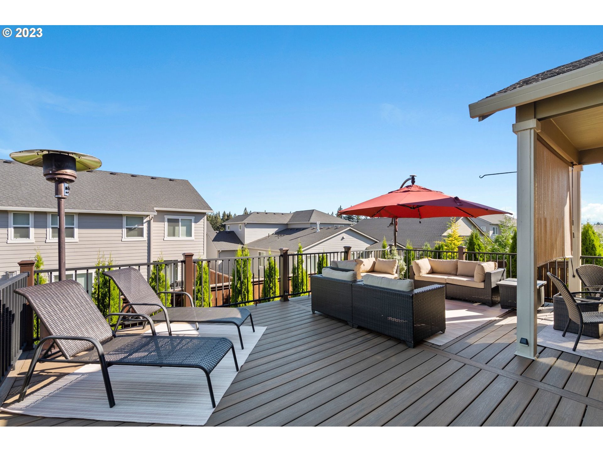 4805 South 17th Way Ridgefield, WA 98642 - Photo 30 of 33 a view of patio with chairs and table under an umbrella