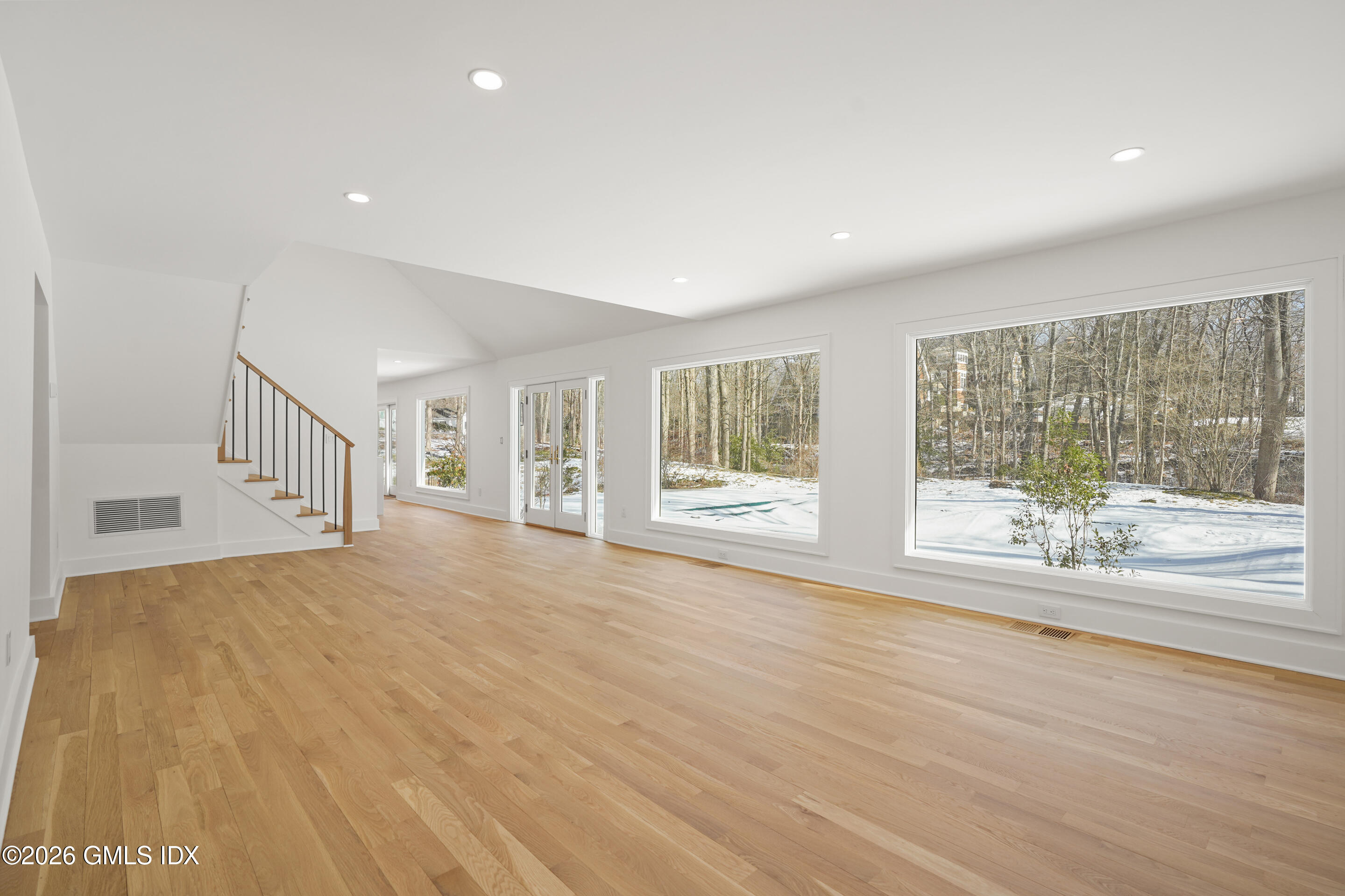 403 Stanwich Road Greenwich, CT 06830 - Photo 14 of 31 a view of an empty room with wooden floor and a window