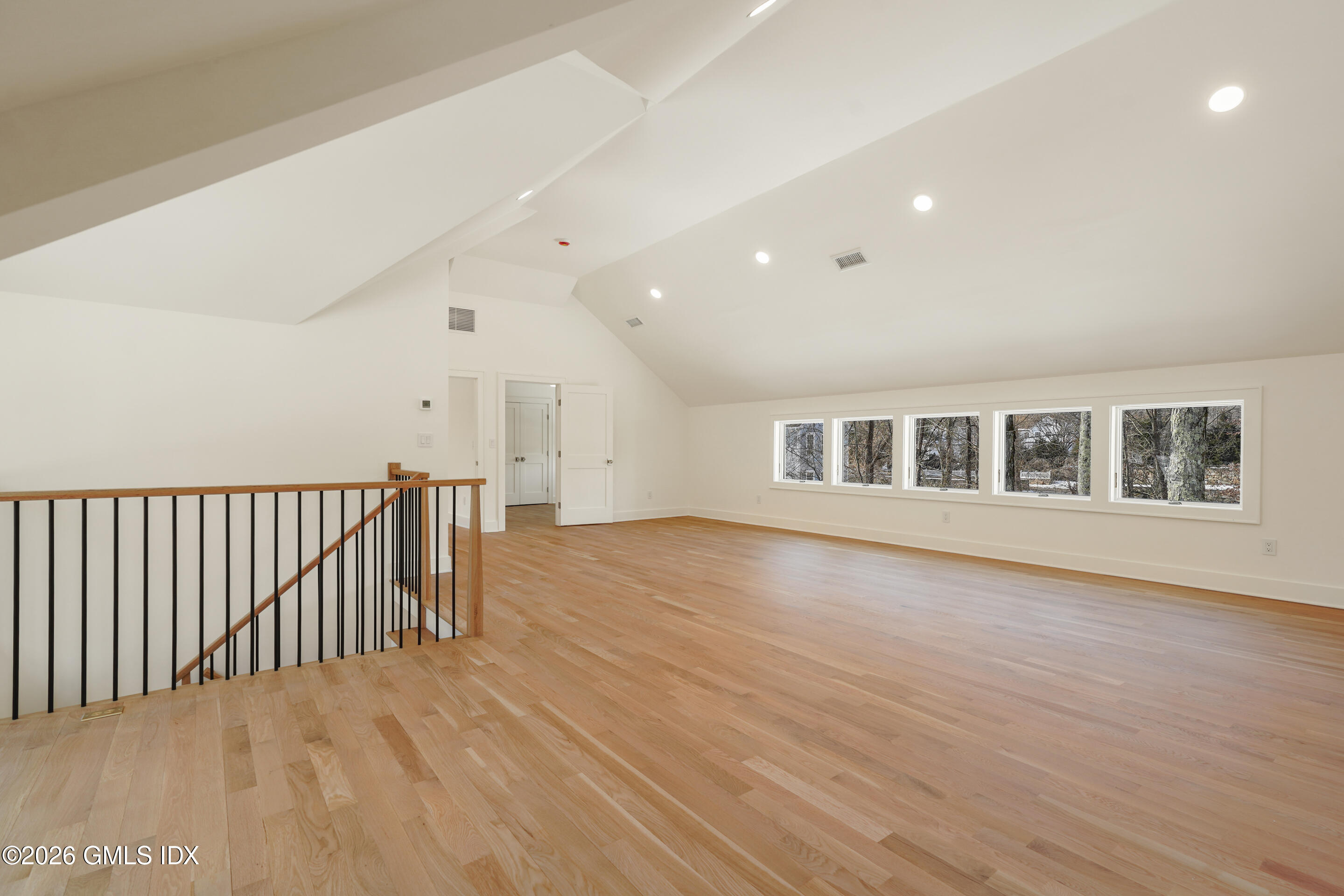 403 Stanwich Road Greenwich, CT 06830 - Photo 19 of 31 a view of an empty room with wooden floor and a window