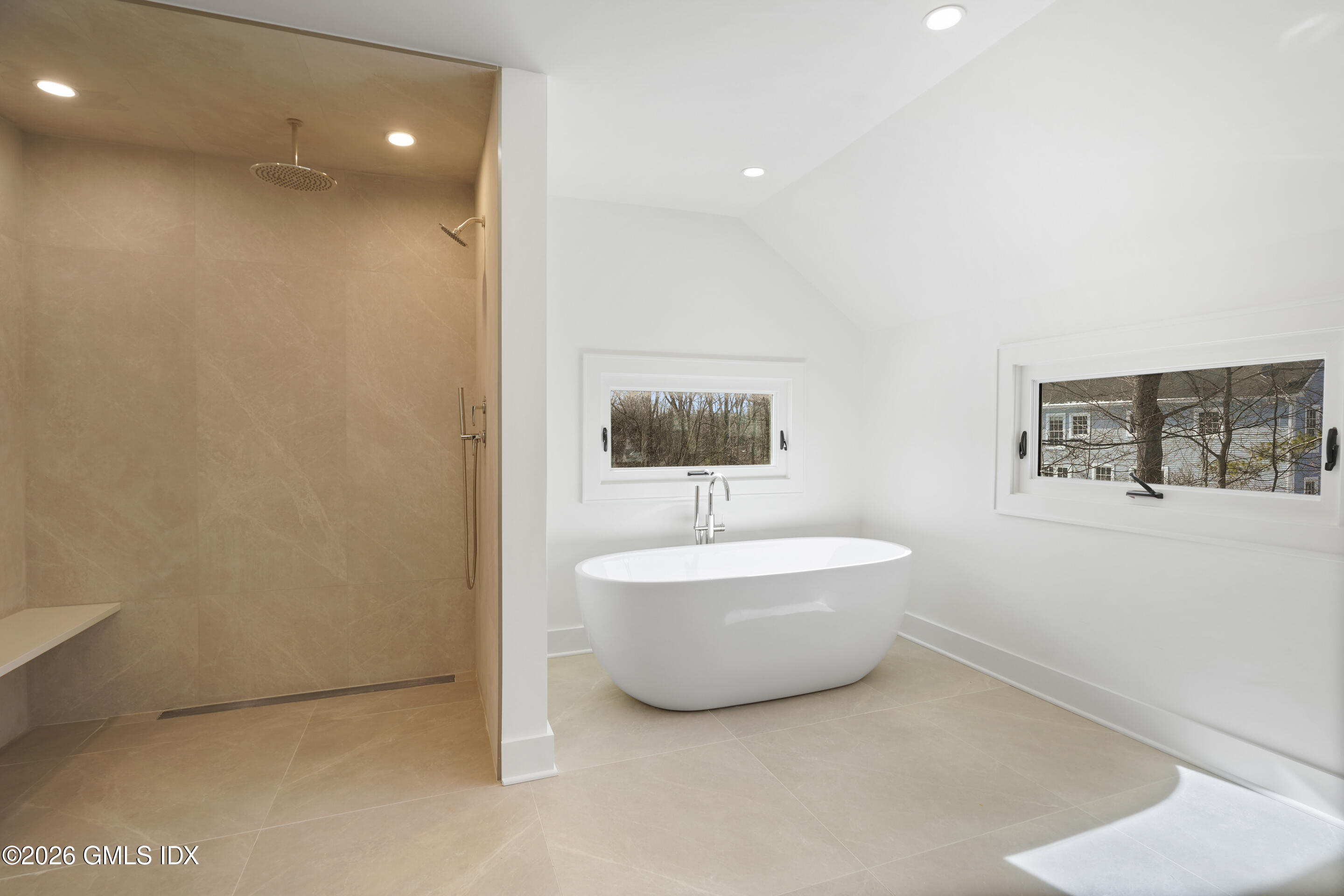 403 Stanwich Road Greenwich, CT 06830 - Photo 21 of 31 a bathroom with a bathtub and sink