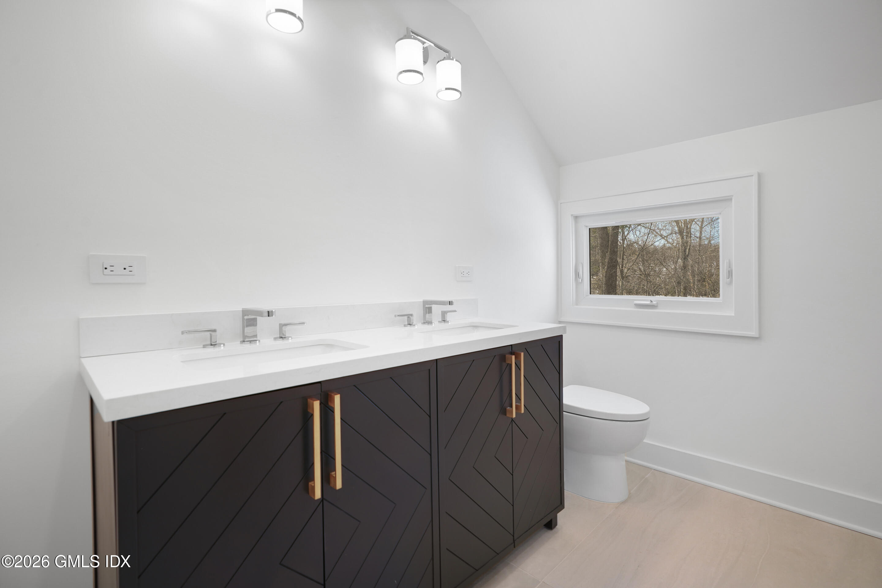 403 Stanwich Road Greenwich, CT 06830 - Photo 23 of 31 a bathroom with a sink vanity and a toilet