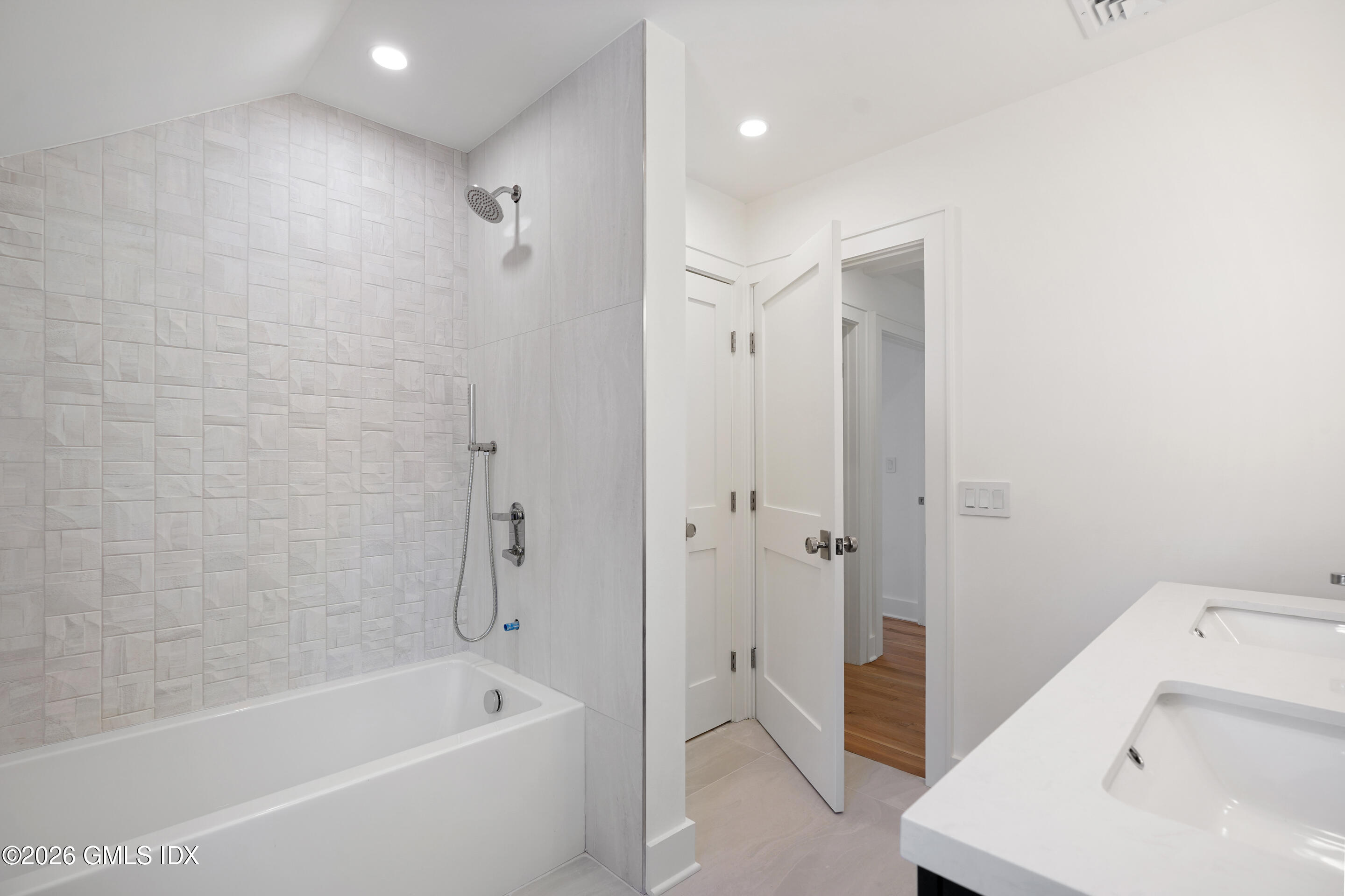 403 Stanwich Road Greenwich, CT 06830 - Photo 24 of 31 a bathroom with a tub a sink and a shower