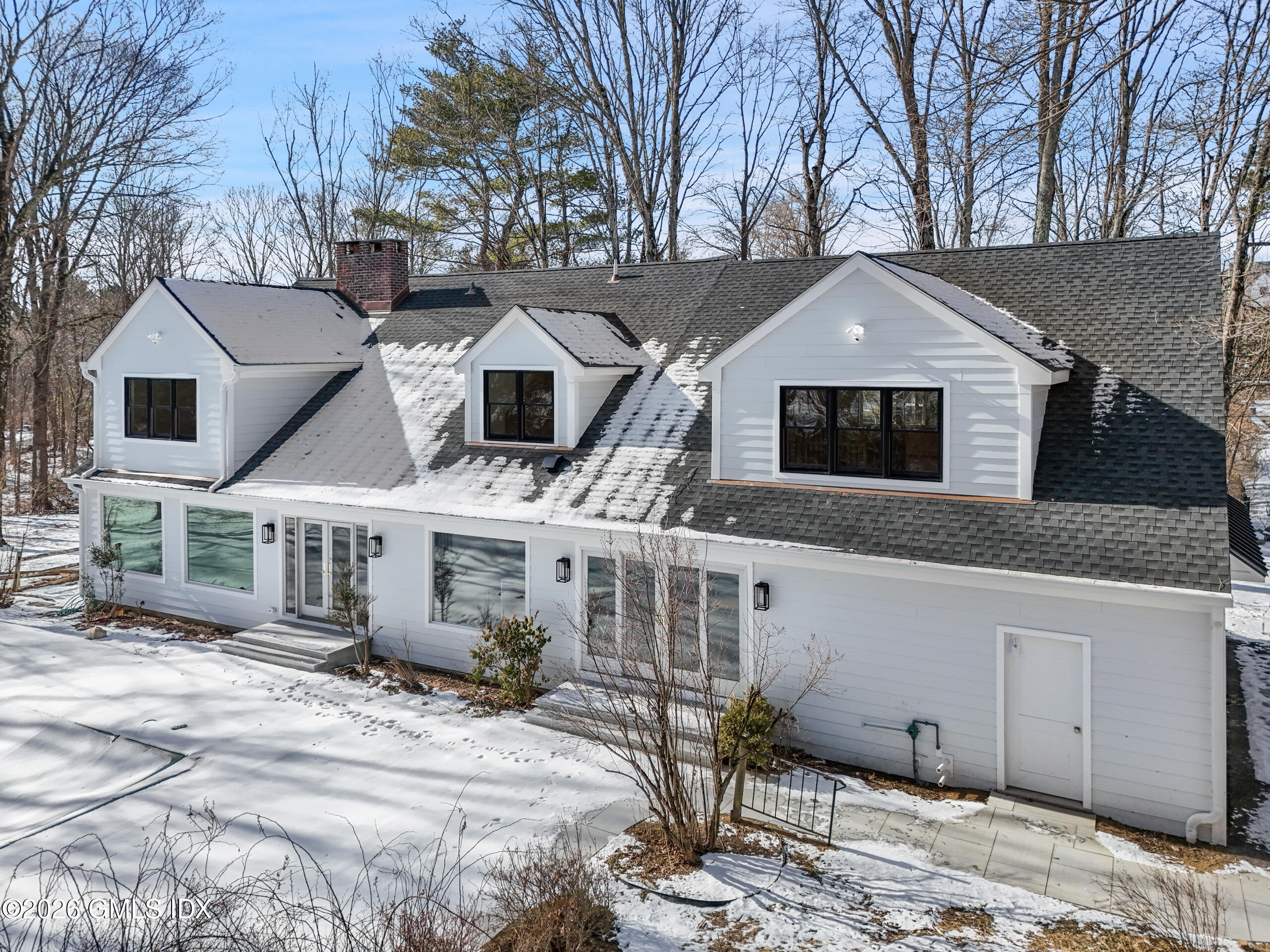 403 Stanwich Road Greenwich, CT 06830 - Photo 28 of 31 a front view of a house with a yard