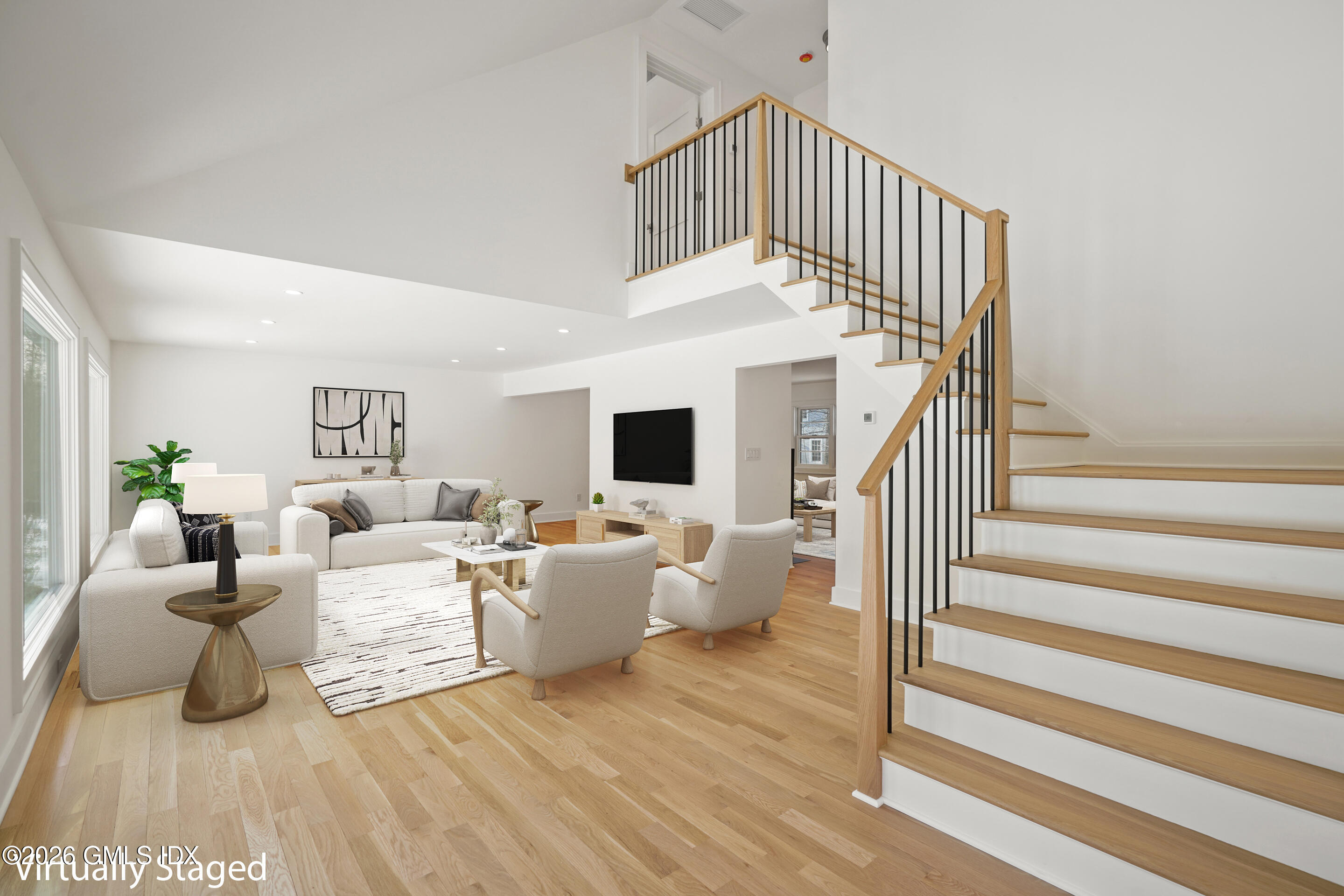 403 Stanwich Road Greenwich, CT 06830 - Photo 4 of 31 a living room with furniture or stairs and a flat screen tv