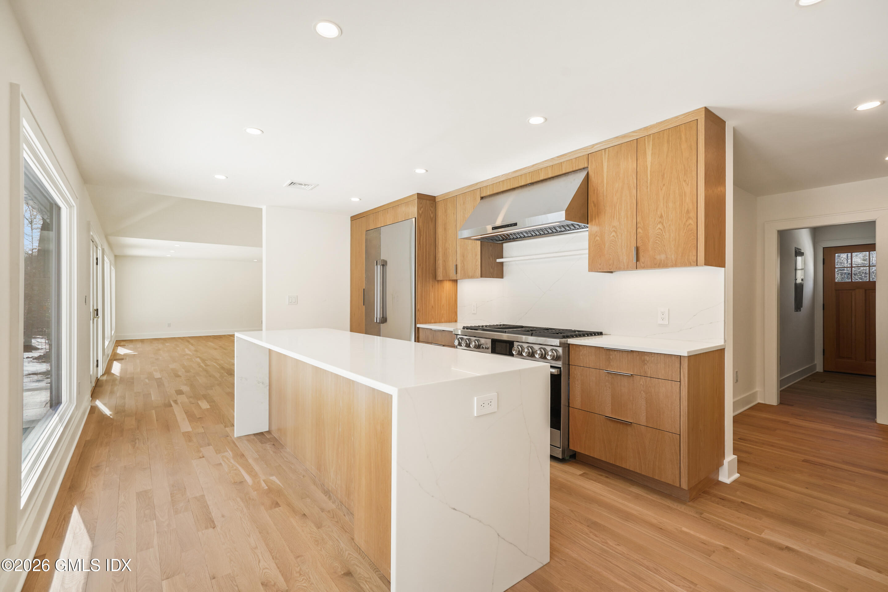 403 Stanwich Road Greenwich, CT 06830 - Photo 7 of 31 a kitchen with cabinets and wooden floor