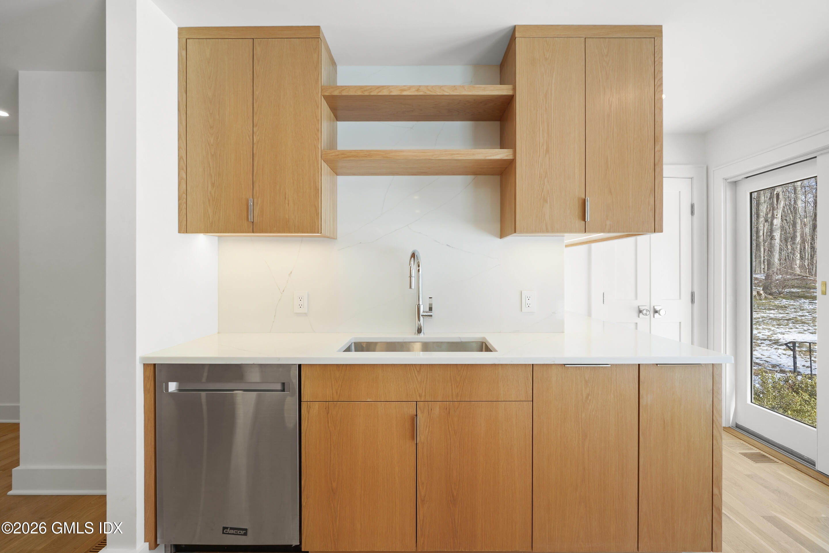 403 Stanwich Road Greenwich, CT 06830 - Photo 9 of 31 a kitchen with a sink and a window