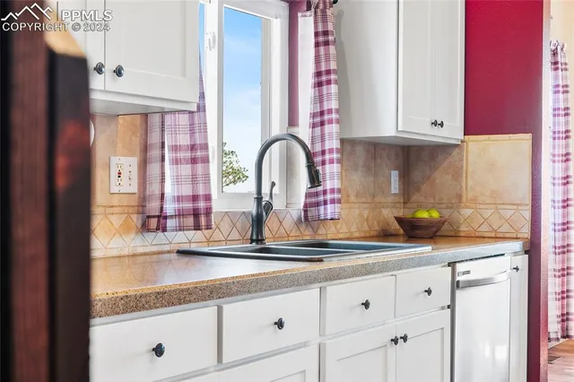 a bedroom with a bed a couch and a window