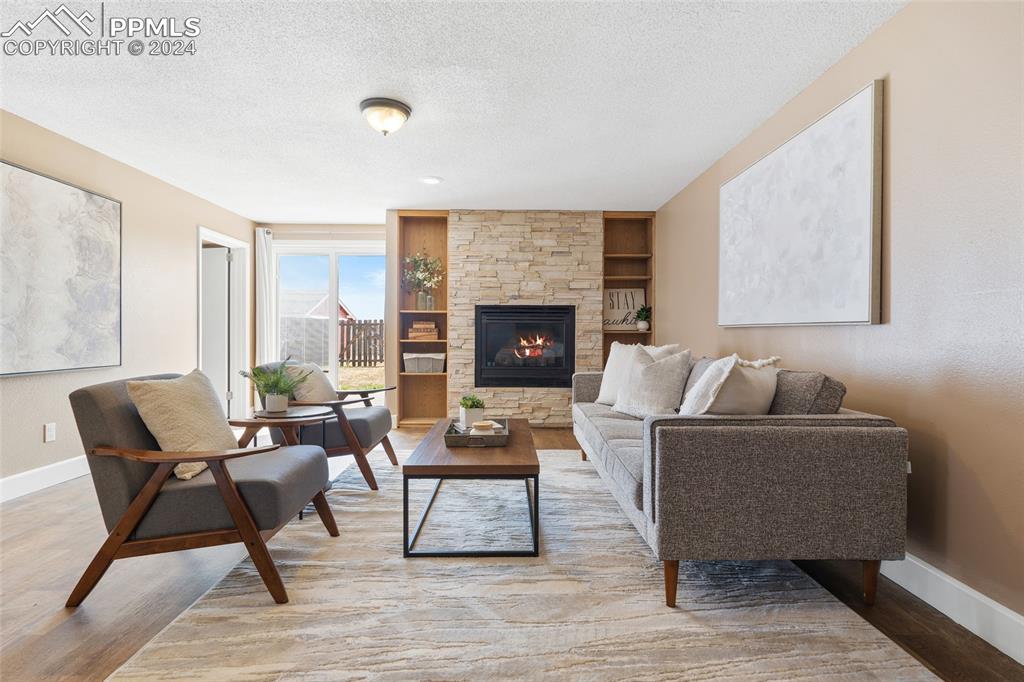 16145 Turftop Terrace Elbert, CO 80106 - Photo 19 of 29 a living room with furniture and a fireplace