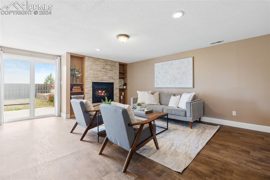 16145 Turftop Terrace Elbert, CO 80106 - Photo 20 of 29 a living room with furniture and a fireplace