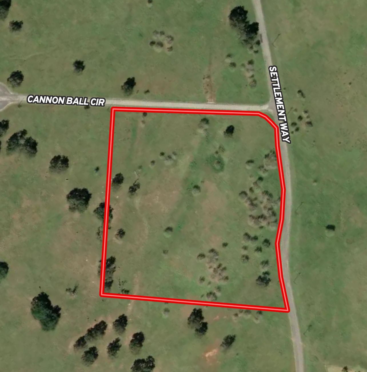 Lot 17 Settlement Way Luling, TX 78648 - Photo 14 of 14 A generous undeveloped lot bordered by two roads, offering ample space for future plans.