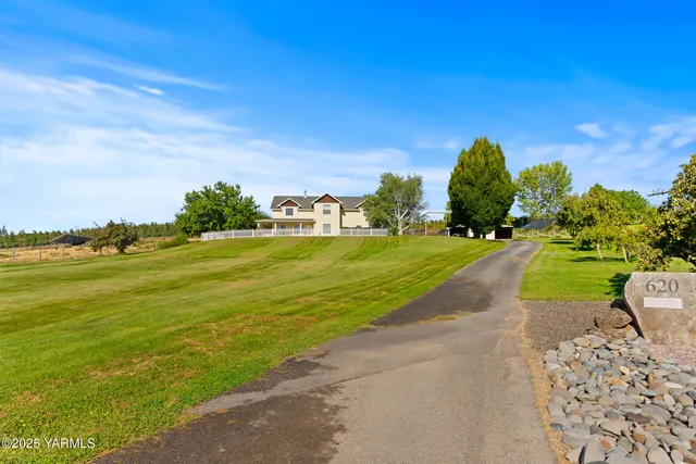a view of a golf course with an ocean