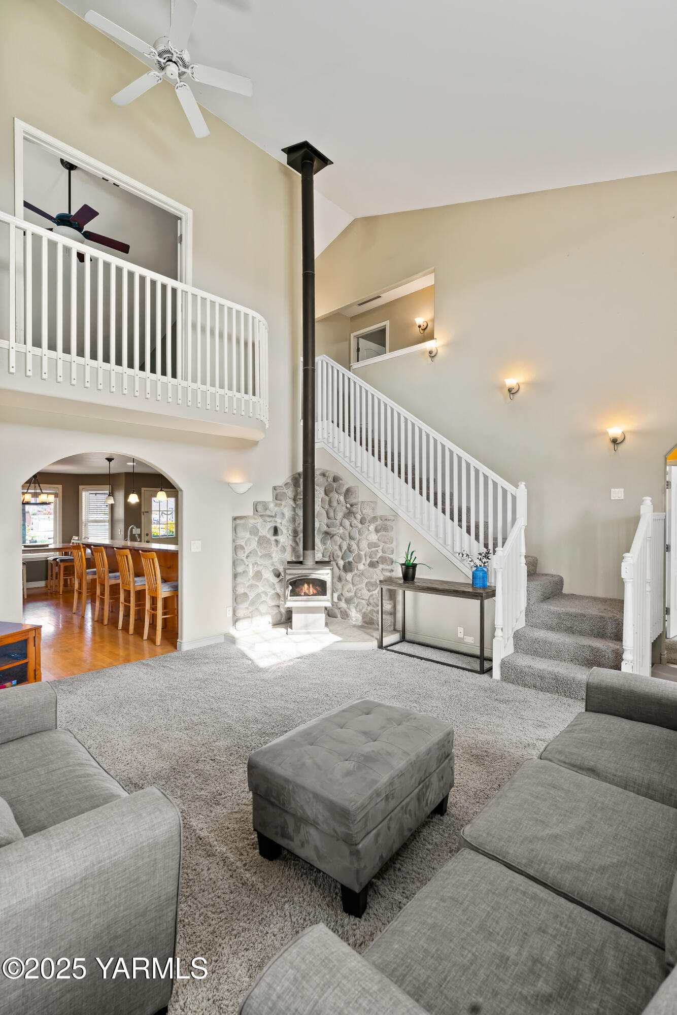620 Tibbling Road Selah, WA 98942 - Photo 12 of 60 a living room with furniture stairs and a rug