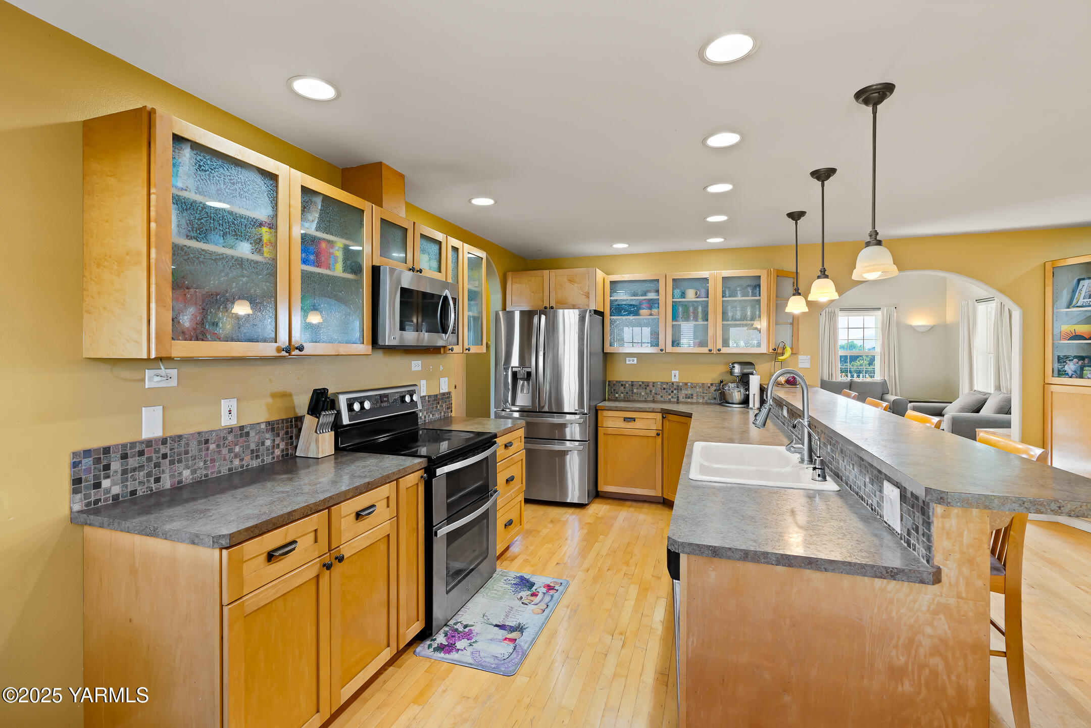 620 Tibbling Road Selah, WA 98942 - Photo 16 of 60 a kitchen with stainless steel appliances granite countertop sink stove and refrigerator