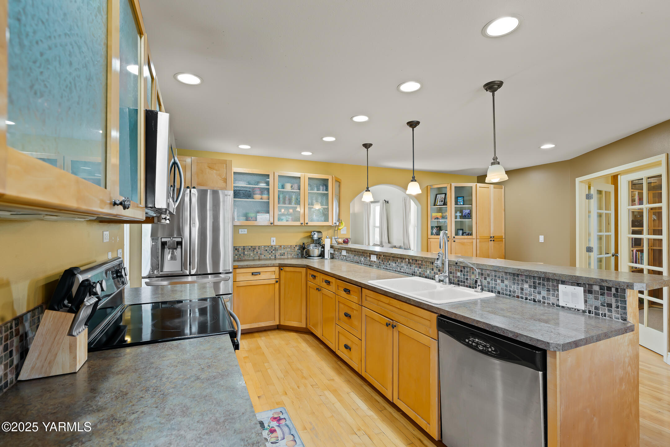 620 Tibbling Road Selah, WA 98942 - Photo 17 of 60 a kitchen with stainless steel appliances granite countertop a sink and stove