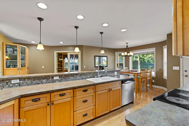 a bedroom with a bed and a chair