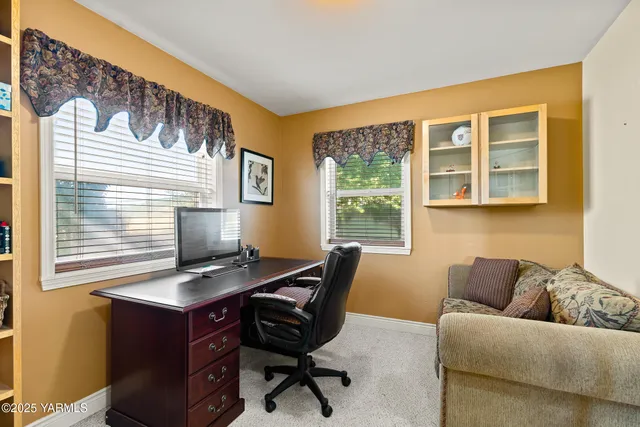 a bedroom with furniture and wooden floor