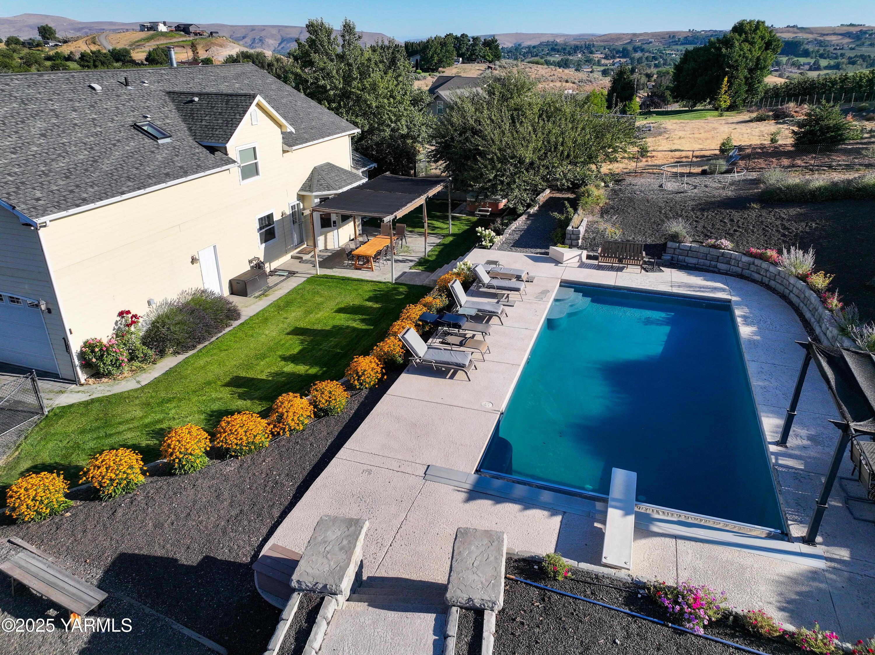 620 Tibbling Road Selah, WA 98942 - Photo 3 of 60 an aerial view of a house with a garden and lake view