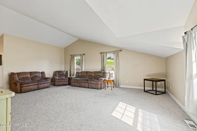 a view of a backyard with sitting area