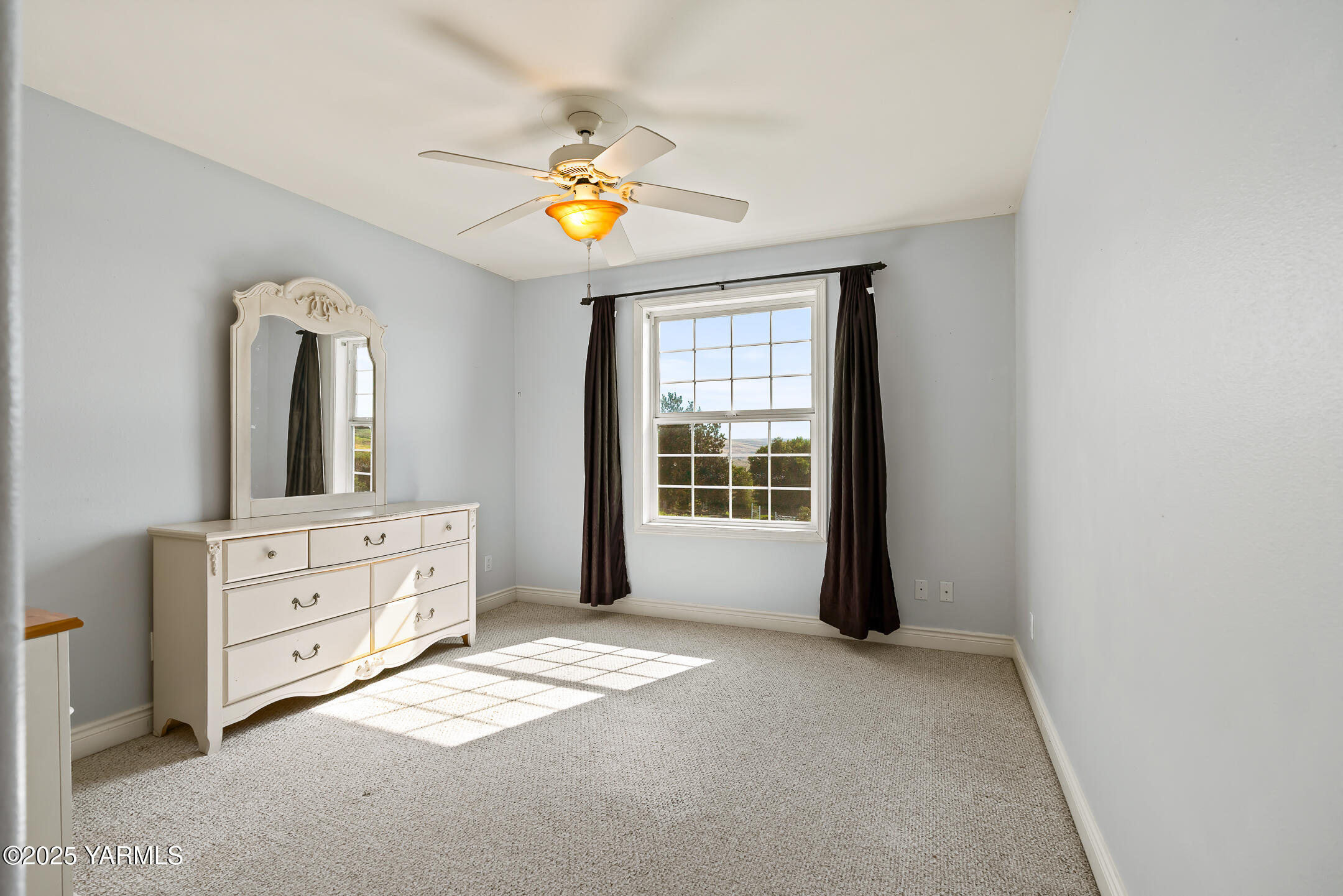 620 Tibbling Road Selah, WA 98942 - Photo 35 of 60 a view of a bedroom with a window and cabinet