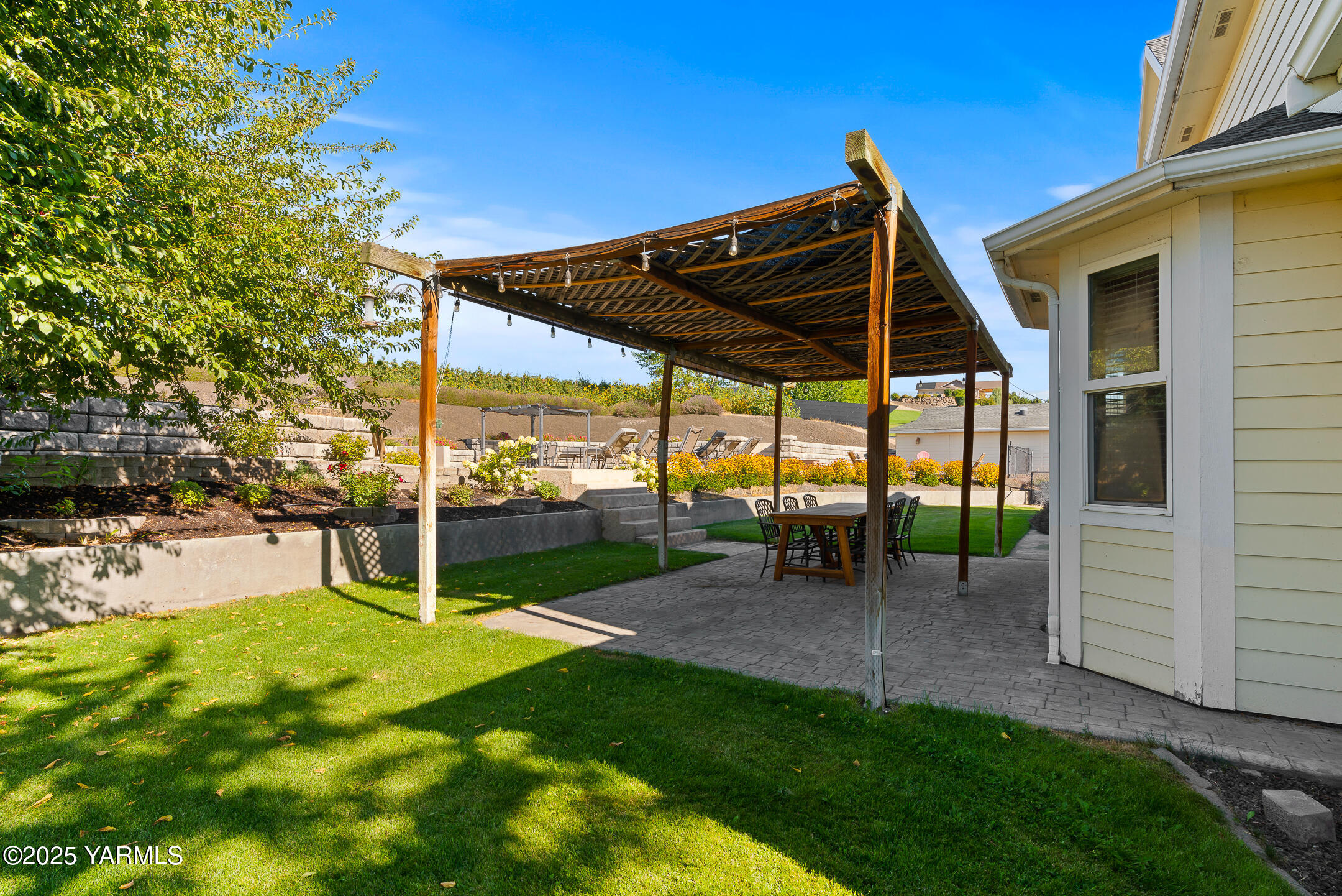 620 Tibbling Road Selah, WA 98942 - Photo 38 of 60 a view of a chair and table in backyard of the house