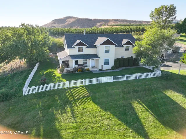 an aerial view of a house with a garden