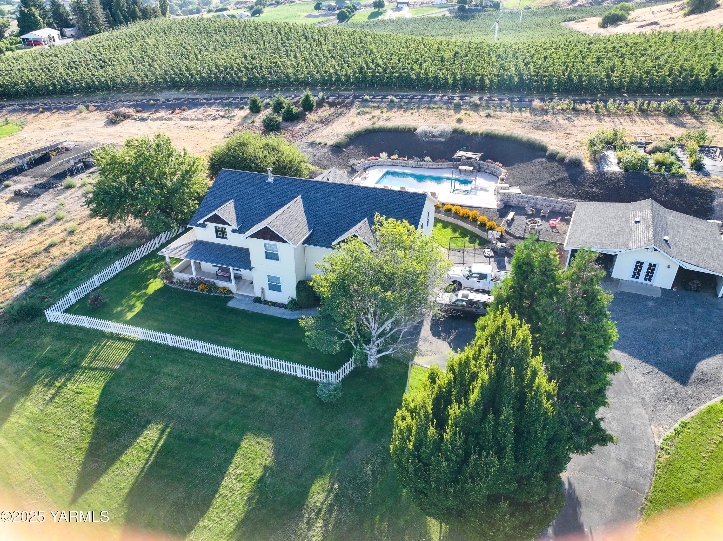 620 Tibbling Road Selah, WA 98942 - Photo 49 of 60 an aerial view of a house with a garden and lake view