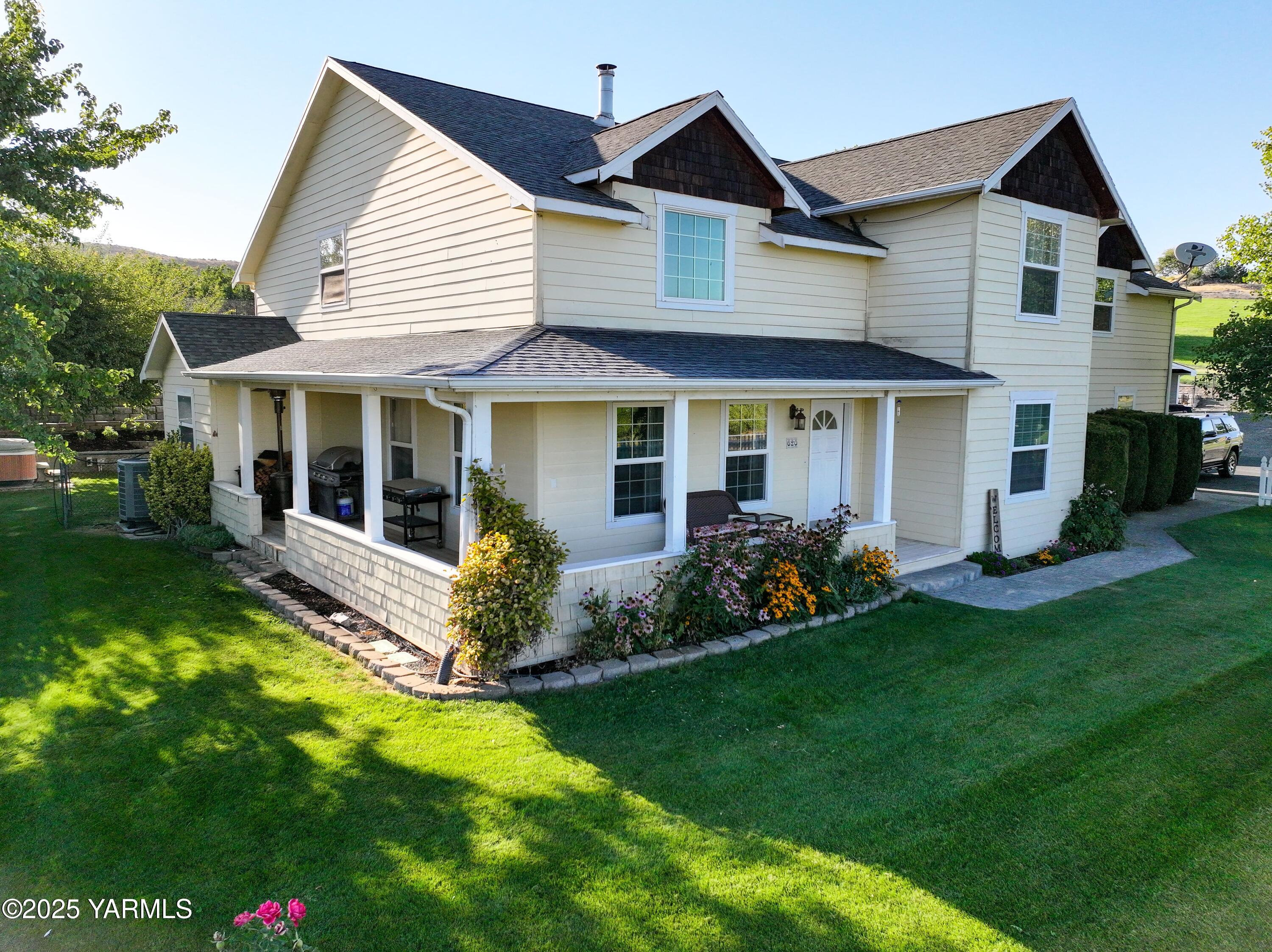 620 Tibbling Road Selah, WA 98942 - Photo 52 of 60 a front view of a house with a garden and porch