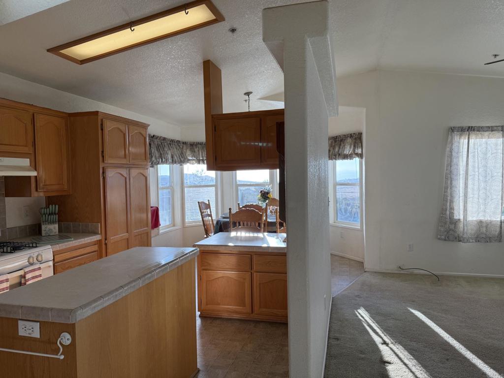 37697 Montezuma Valley Road Ranchita, CA 92066 - Photo 21 of 47 a kitchen with a sink stove and refrigerator