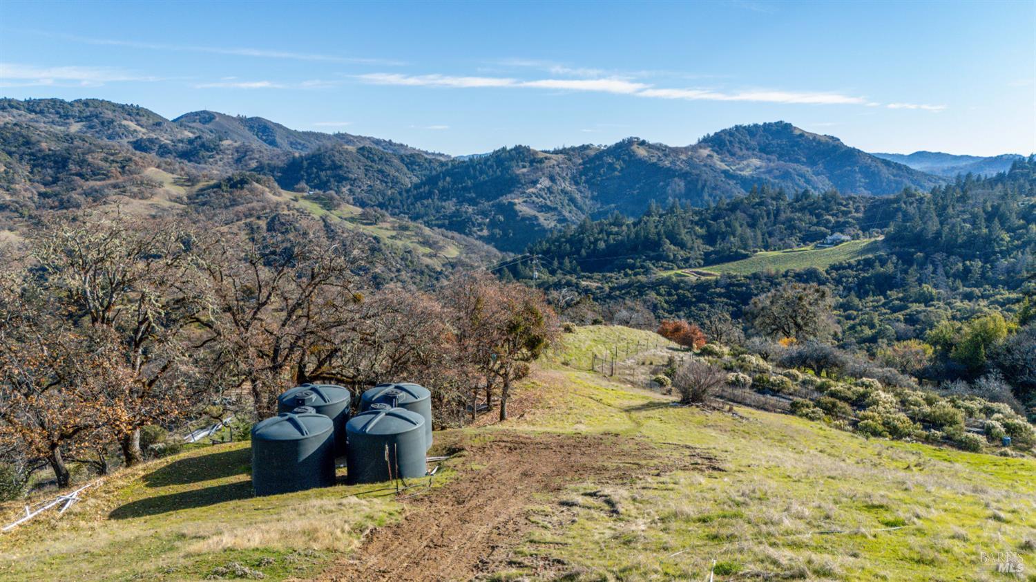 6620 Robinson Creek Road Ukiah, CA 95482 - Photo 14 of 47 a view of a backyard of a house with a mountain