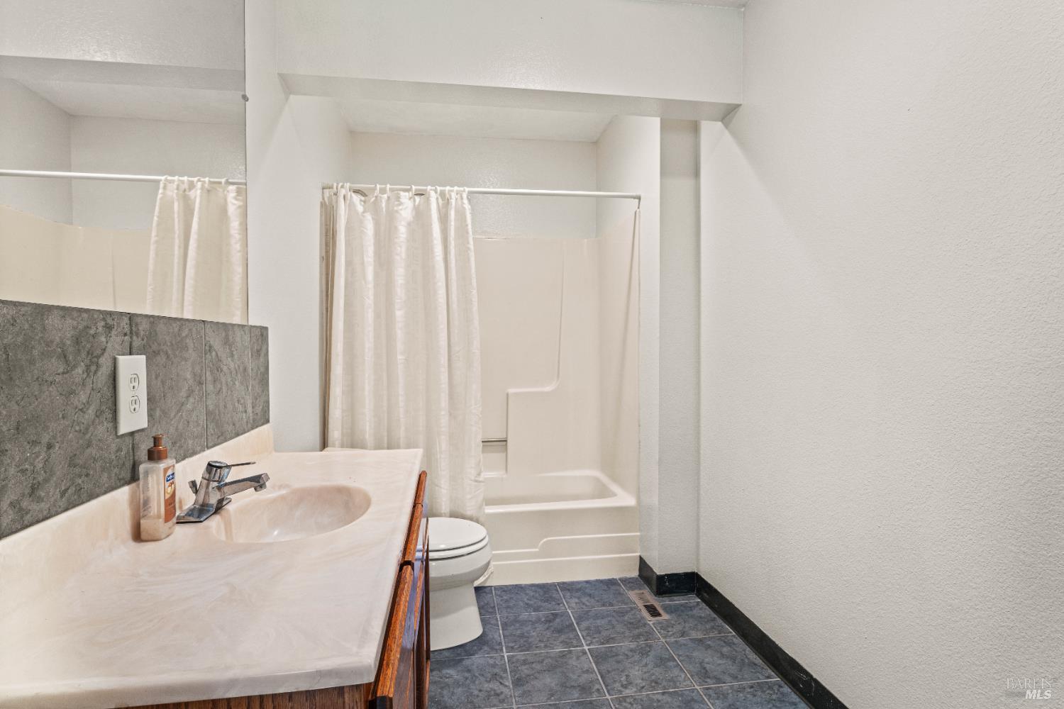 6620 Robinson Creek Road Ukiah, CA 95482 - Photo 23 of 47 a bathroom with a sink a toilet and tub