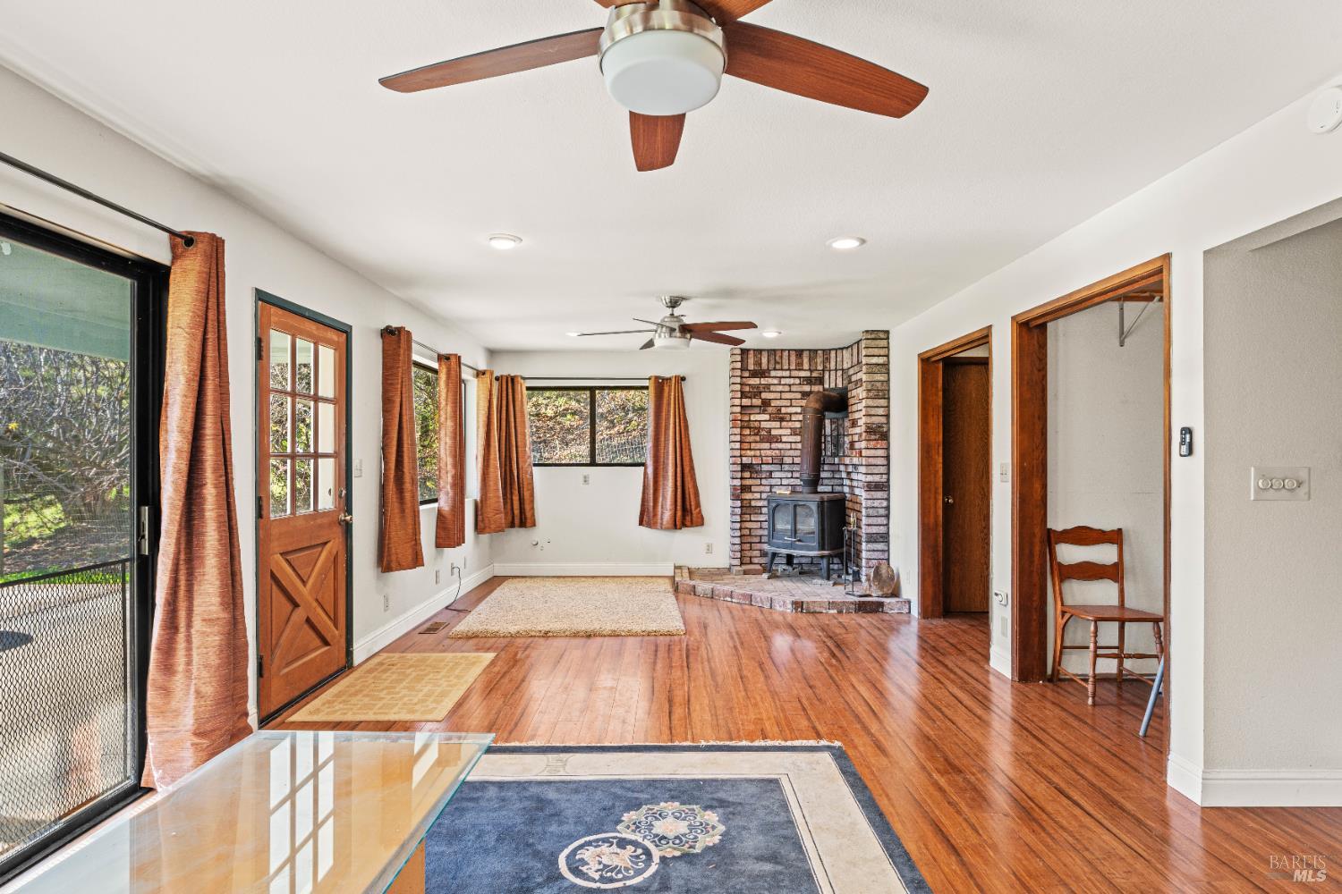 6620 Robinson Creek Road Ukiah, CA 95482 - Photo 25 of 47 a living room with stainless steel appliances furniture a rug and a large window