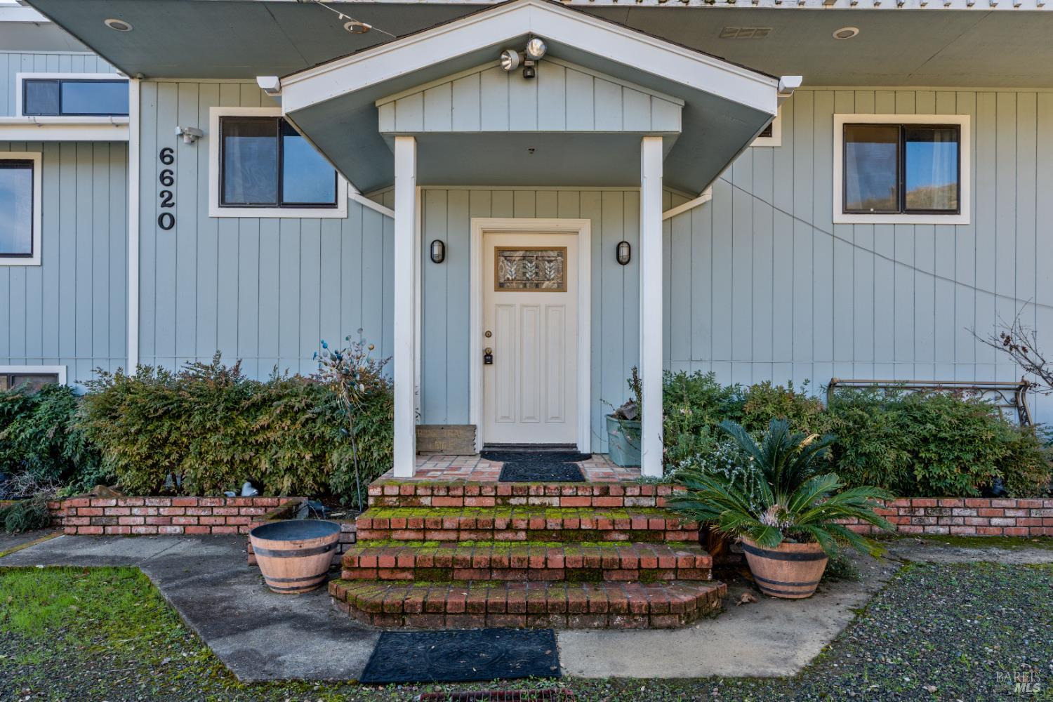 6620 Robinson Creek Road Ukiah, CA 95482 - Photo 3 of 47 a front view of a house with a garden