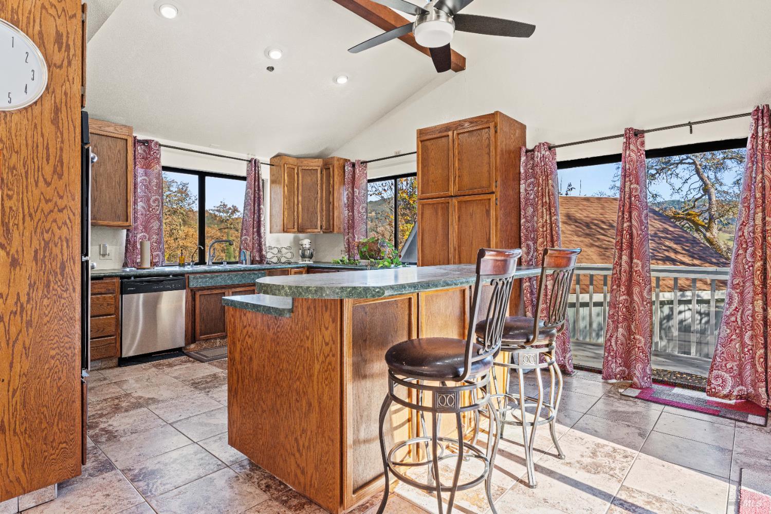6620 Robinson Creek Road Ukiah, CA 95482 - Photo 40 of 47 a dining table chair next to a window with kitchen view