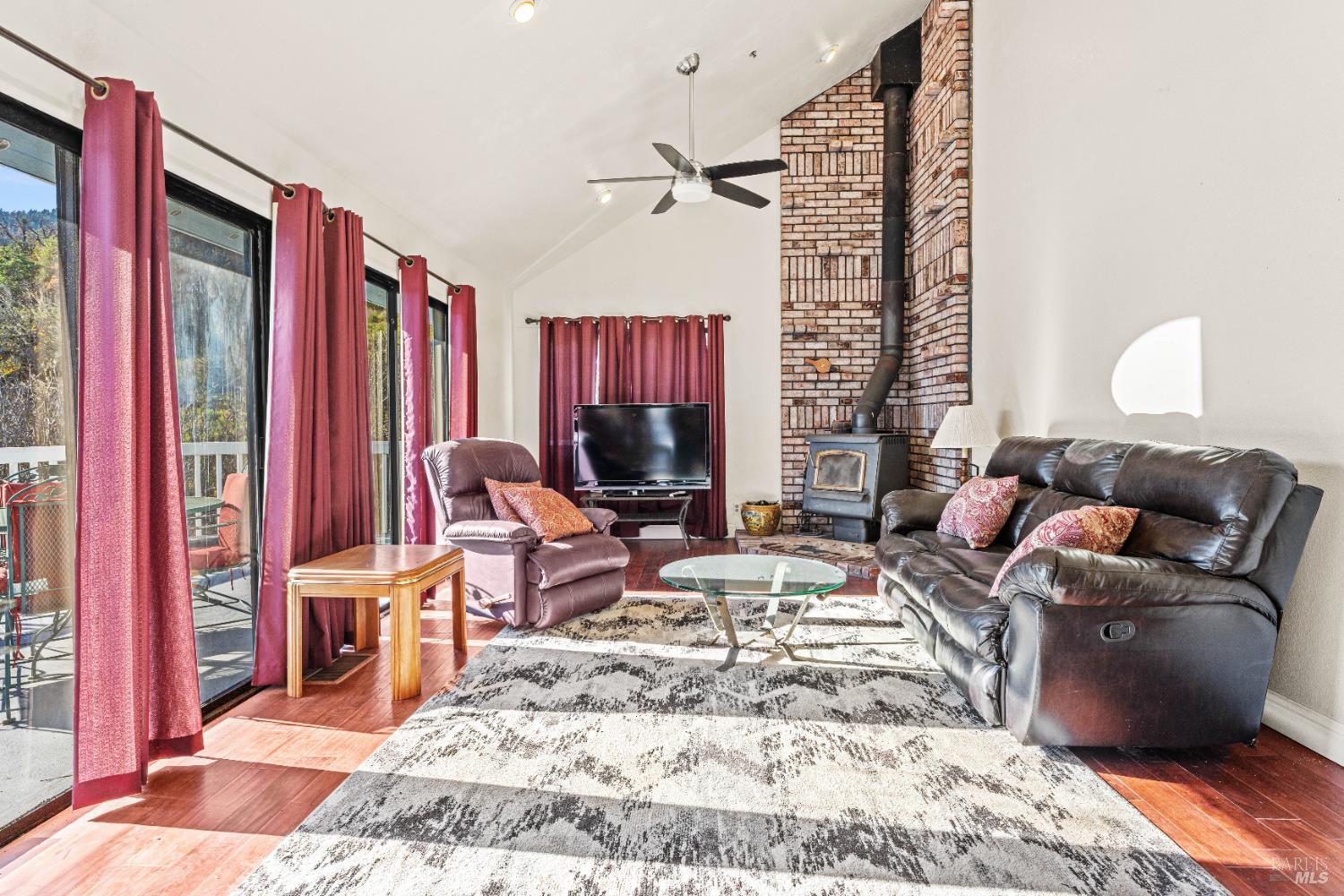 6620 Robinson Creek Road Ukiah, CA 95482 - Photo 44 of 47 a living room with furniture and a flat screen tv