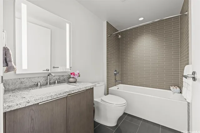 a view of balcony with granite countertop kitchen island and a wooden floor