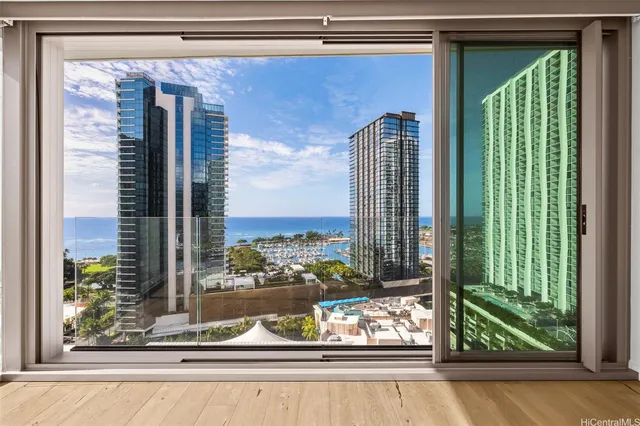 a view of an empty room and a window