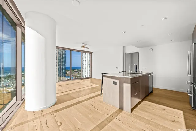 a kitchen with a sink a counter top space and cabinets