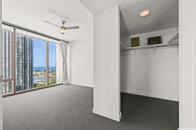 a bathroom with a granite countertop double vanity sink and mirror