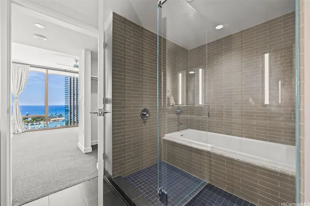 a bathroom with a bathtub and toilet