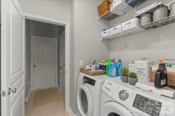 a view of storage and utility room with washer and dryer