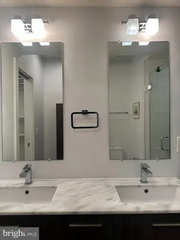 a bathroom with a shower and a sink
