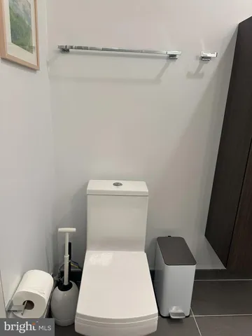 a living room with stainless steel appliances kitchen island granite countertop furniture and a view of kitchen