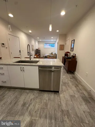 a kitchen with a stove and a refrigerator