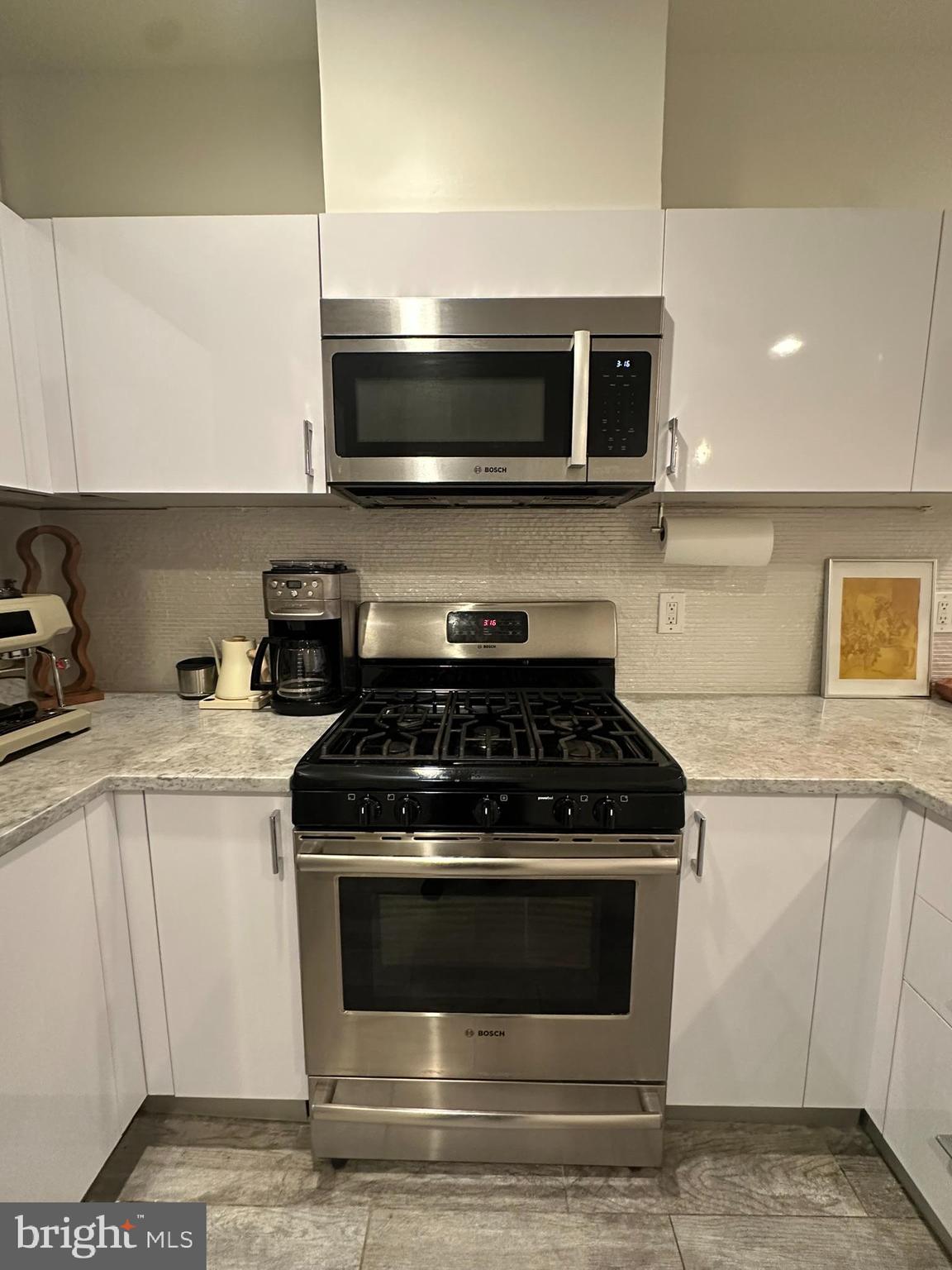 1837 Kalorama Road Northwest, Unit B Washington, DC 20009 - Photo 20 of 45 a stove top oven sitting inside of a kitchen