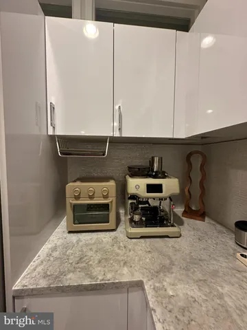 a large kitchen with stainless steel appliances and a sink