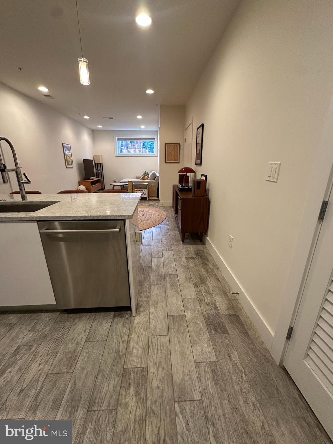 1837 Kalorama Road Northwest, Unit B Washington, DC 20009 - Photo 30 of 45 a living room with stainless steel appliances furniture a refrigerator and a sink