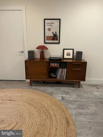 a living room with furniture and a rug