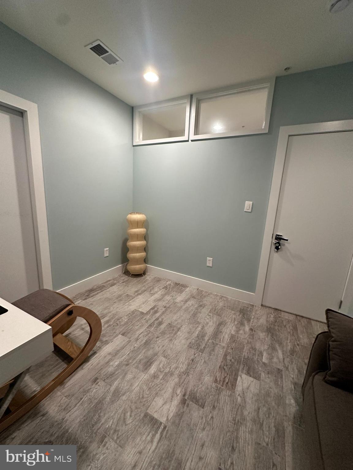 1837 Kalorama Road Northwest, Unit B Washington, DC 20009 - Photo 35 of 45 a bedroom with a bed and gym equipment