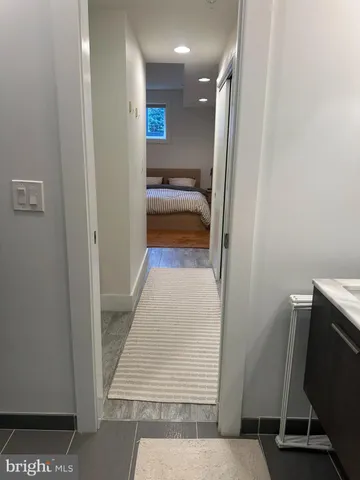 a view of hallway with stairs and furniture